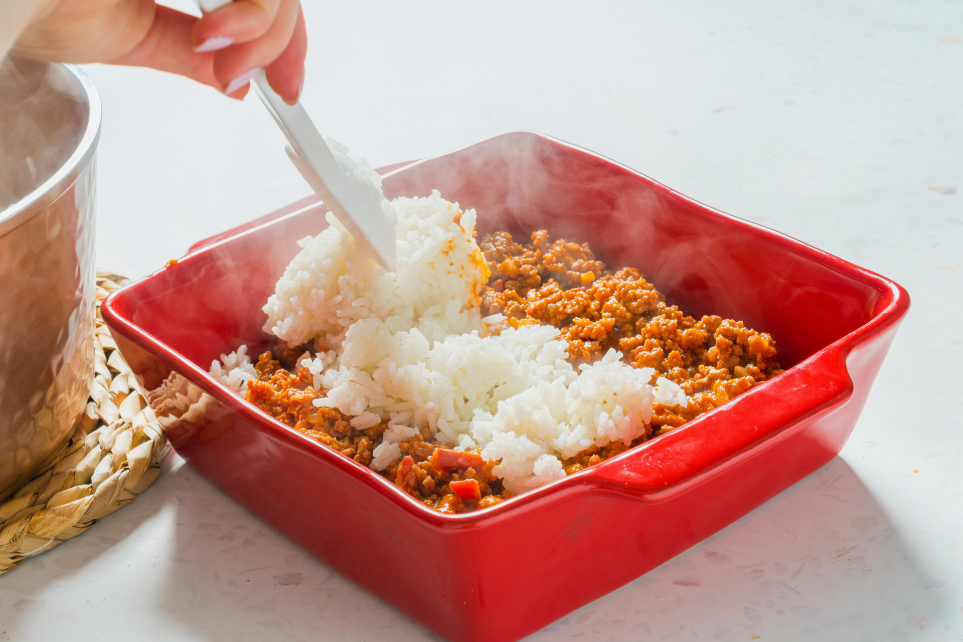 Cobrimento do preparado de carne com arroz